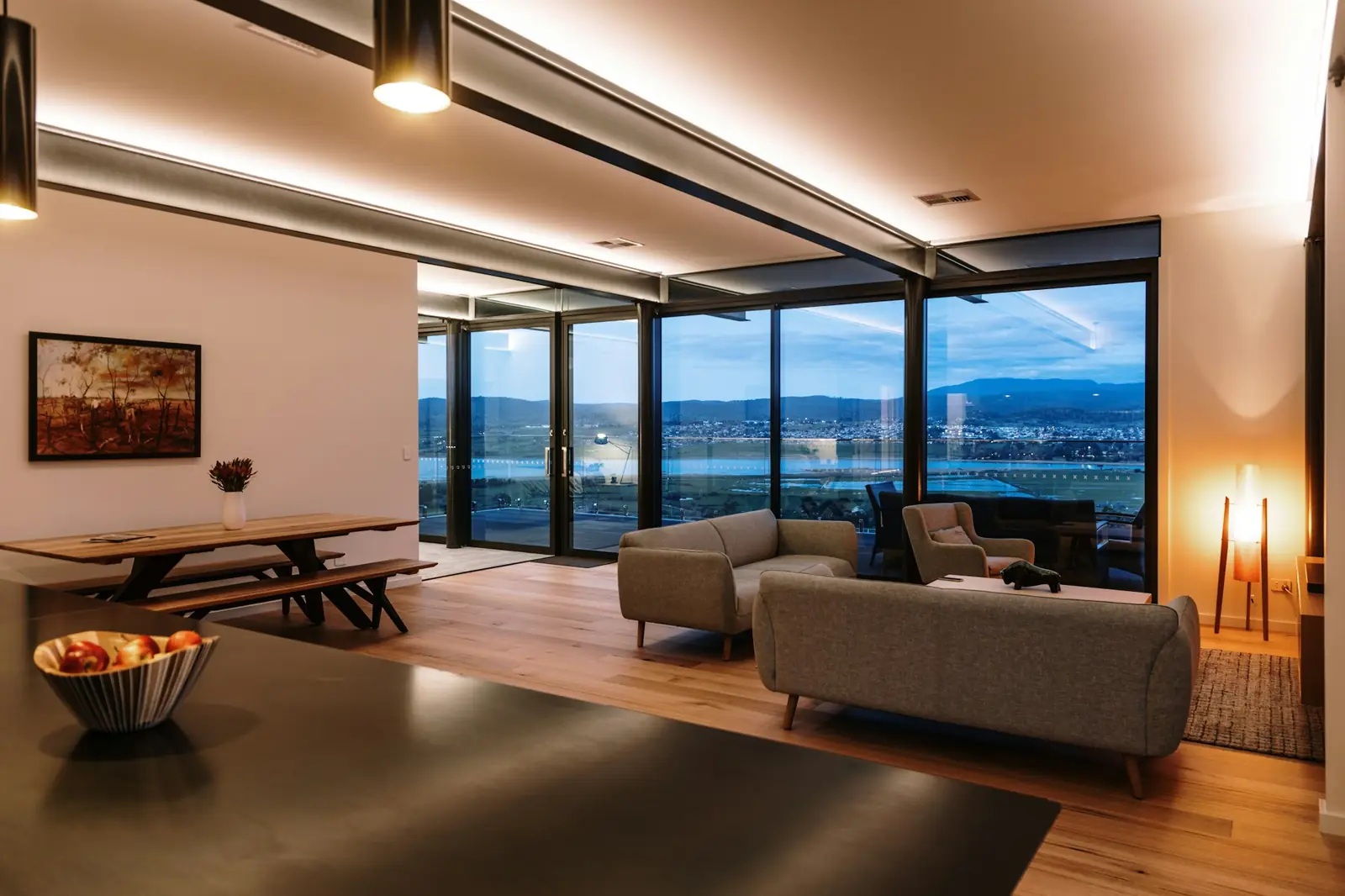 Living room with cove lighting and a floor lamp